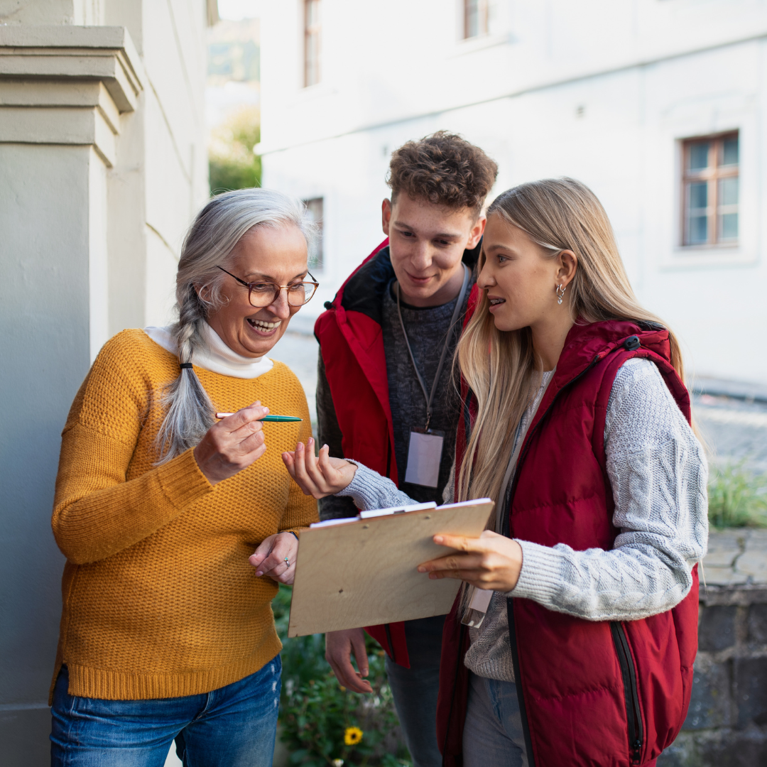 Students canvassing encouraging community members to register to vote