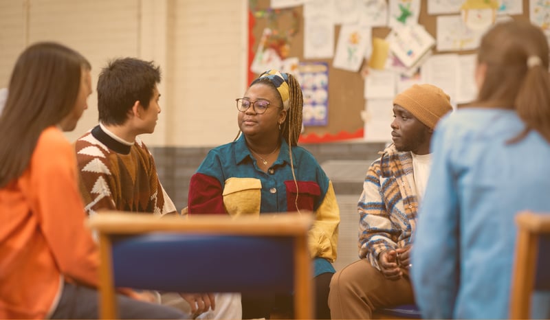A group of conversing college students.