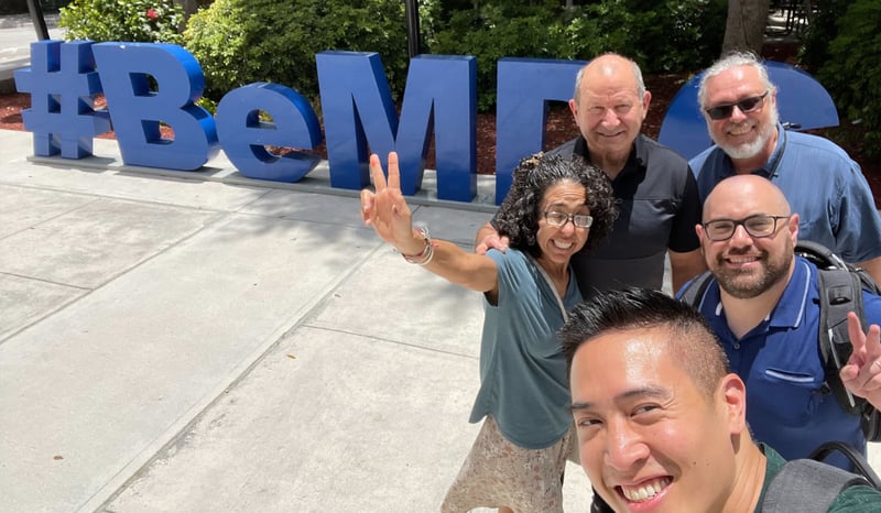 Background image of Josh and the team at iCED Miami Dade on campus with text reading Scaling Civic Engagement Across Eight Campuses with GivePulse