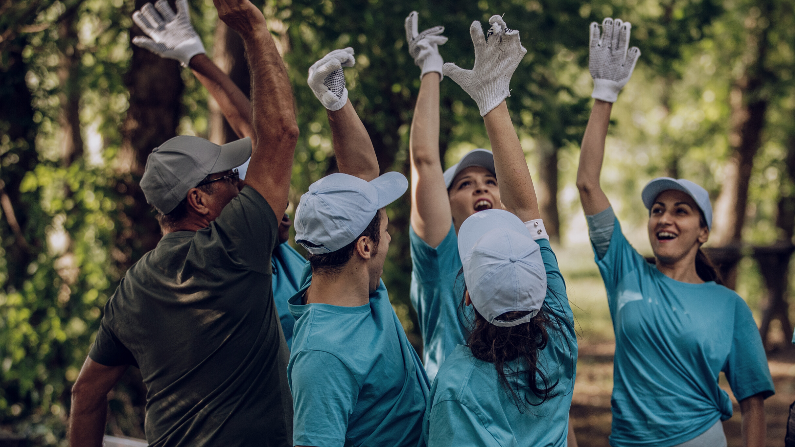 Volunteers picking up trash at a local park 