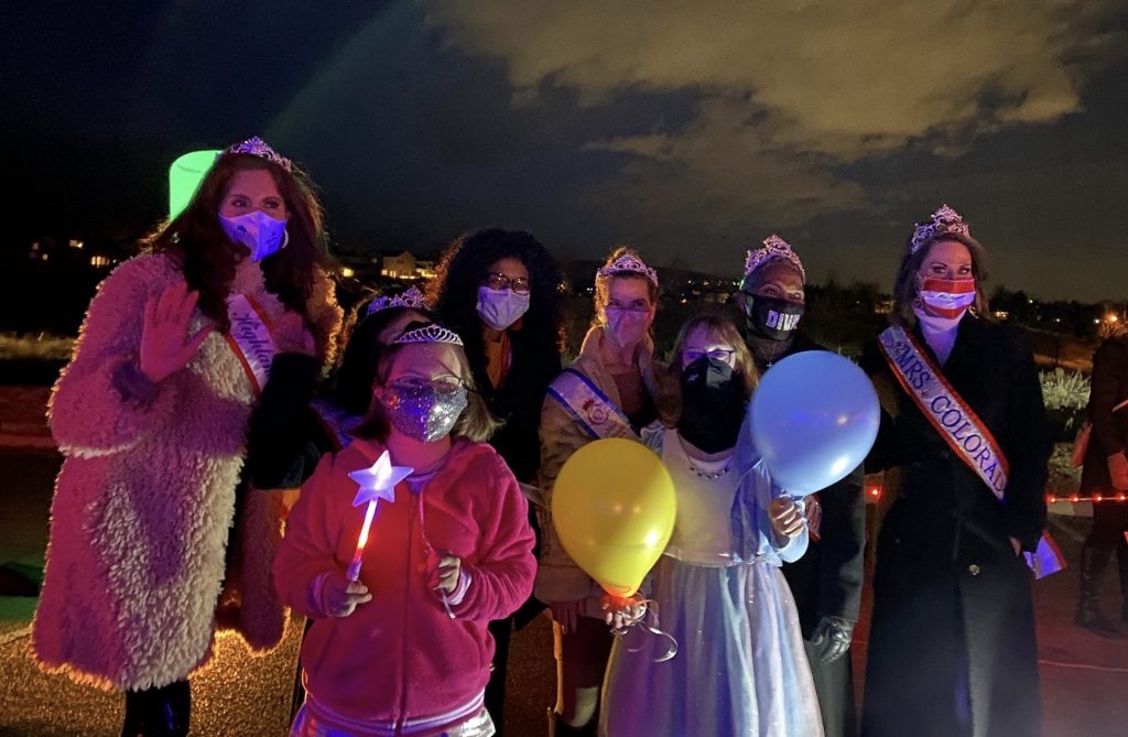 All-Stars club volunteers and participants wearing masks at an event