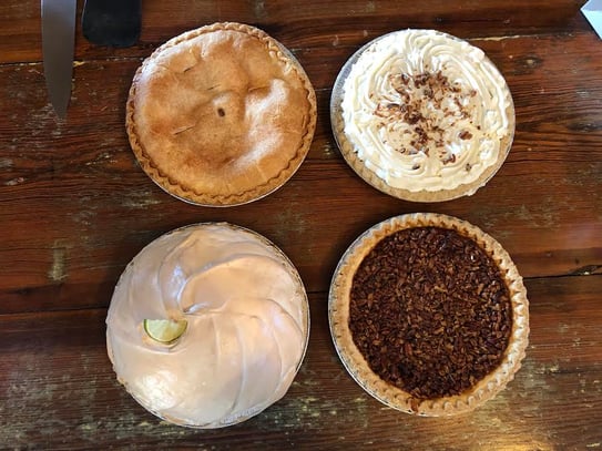Pies laid out on a table