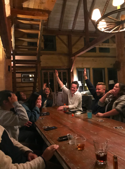 GivePulse team members play a rousing game of Mafia at the holiday retreat