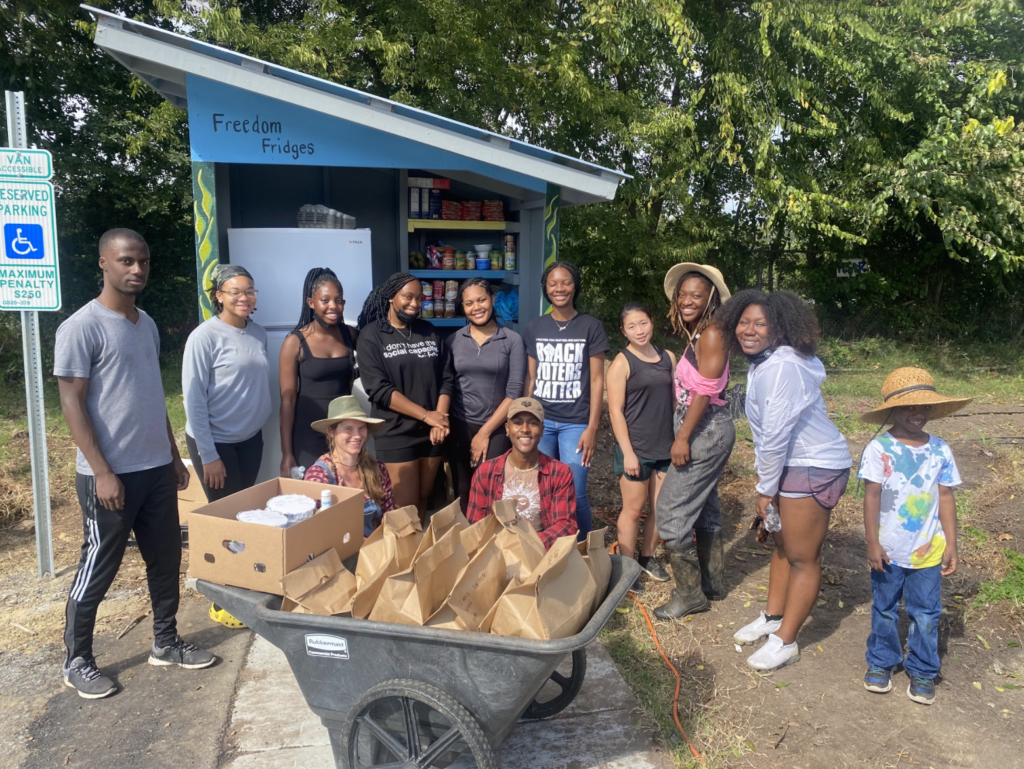 Black Girls Vote Members delivering food to their local free fridge and helping spread voting advocacy