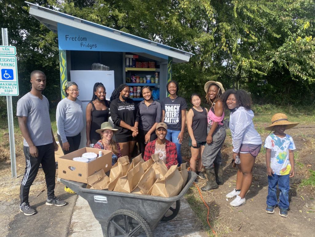 Black Girls Vote members delivering food to their local free fridge and pantry