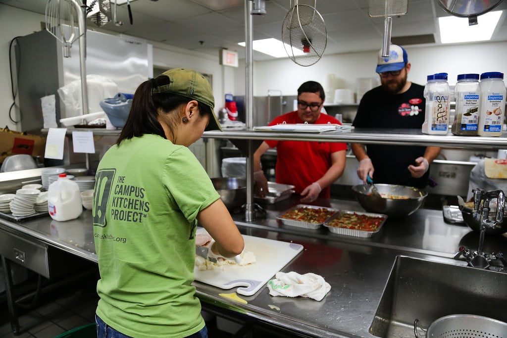 Student volunteers at the UGA Campus Kitchen cooking meals