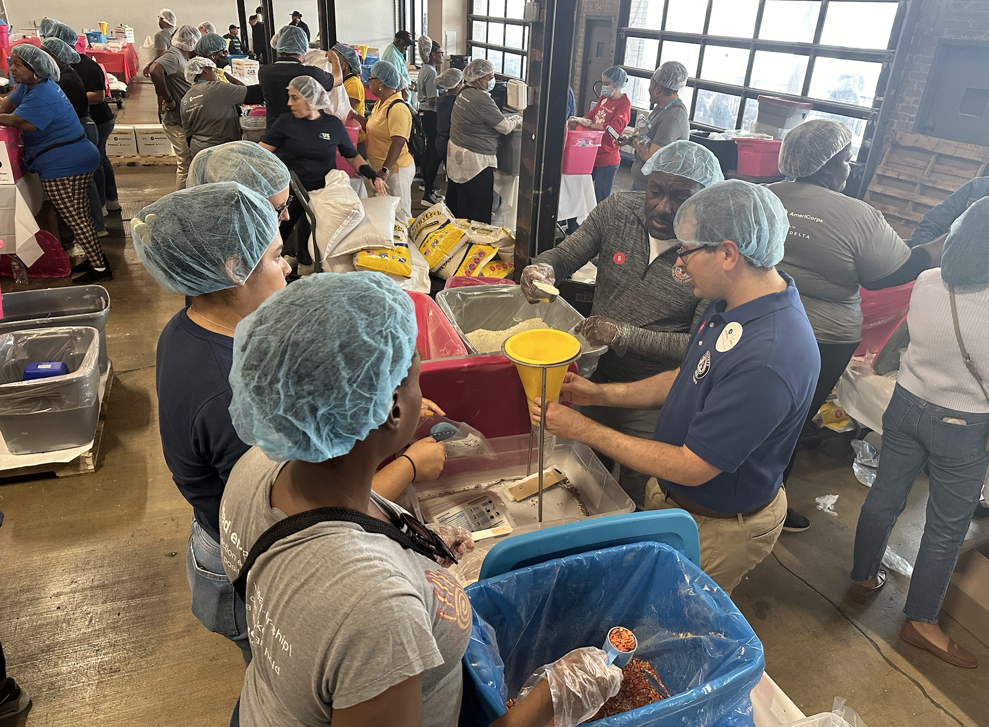 AmeriCorps Members packing food for the 9/11 Day of Service