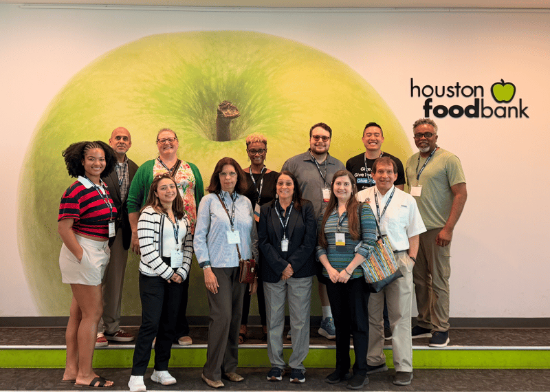 Group of volunteers and community members at the Houston Food Bank 