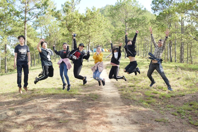 Eight students jumping in midair. 