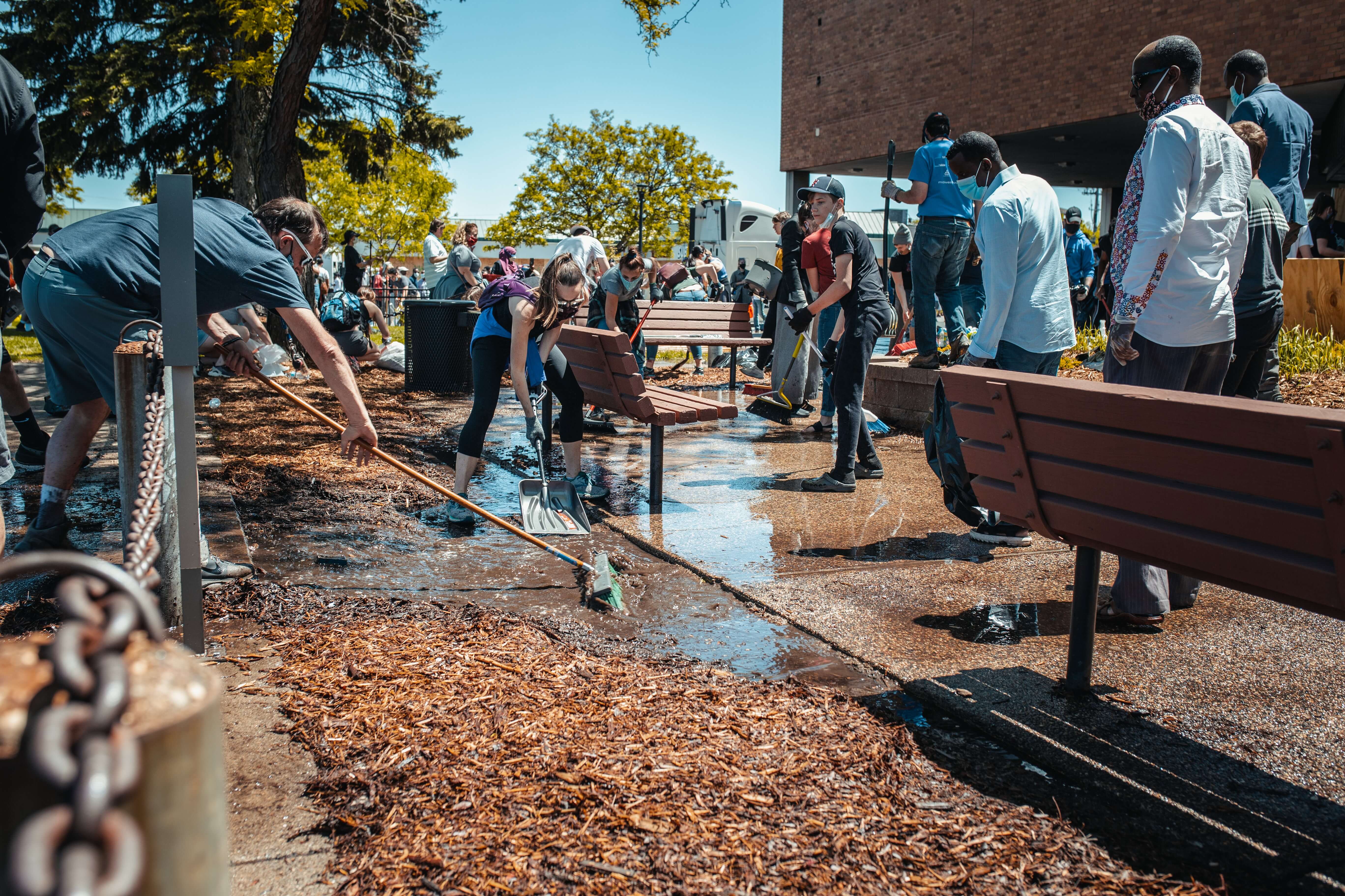 Volunteers helping their city clean up a local park