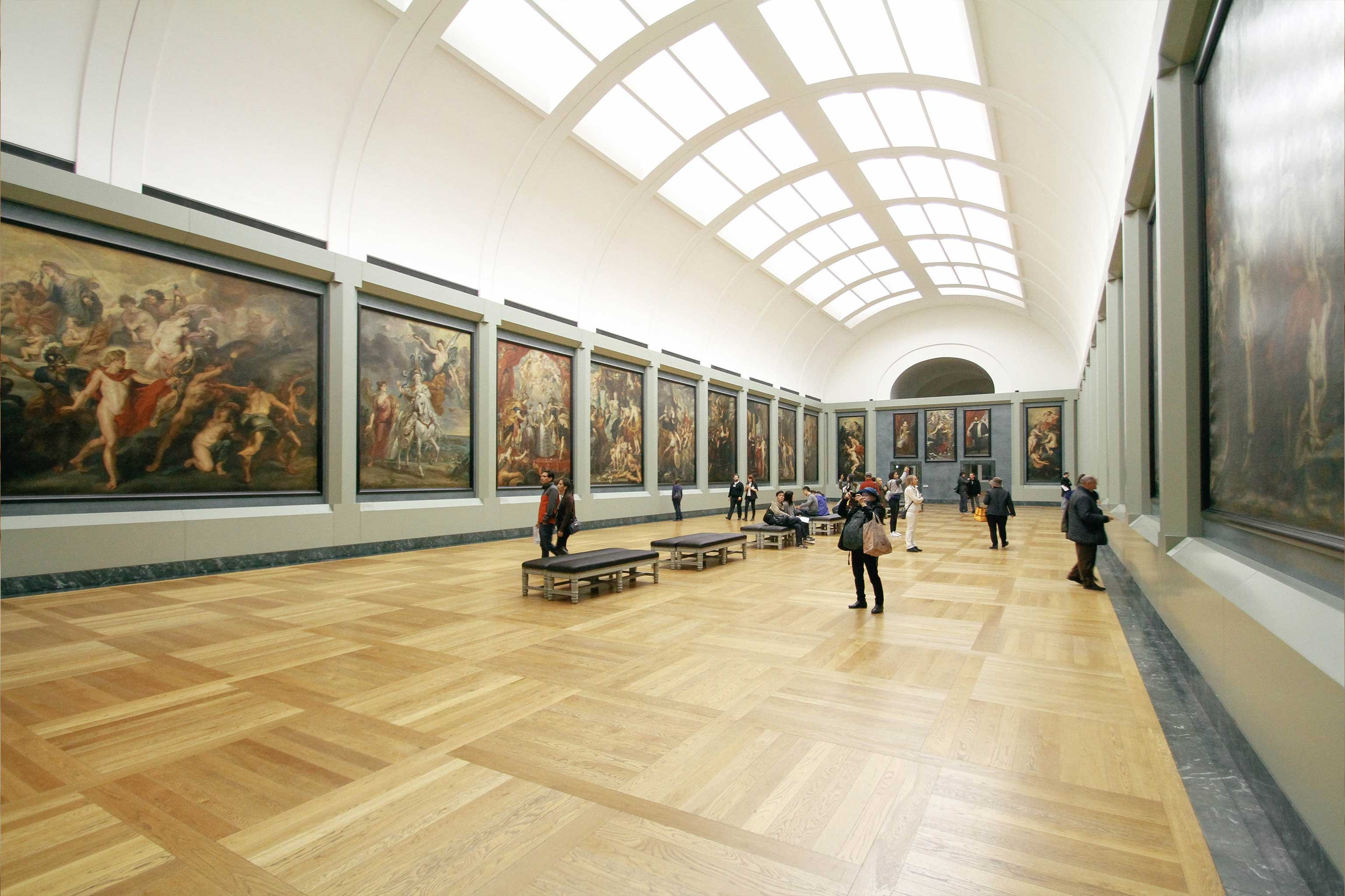 People walking through an art museum 