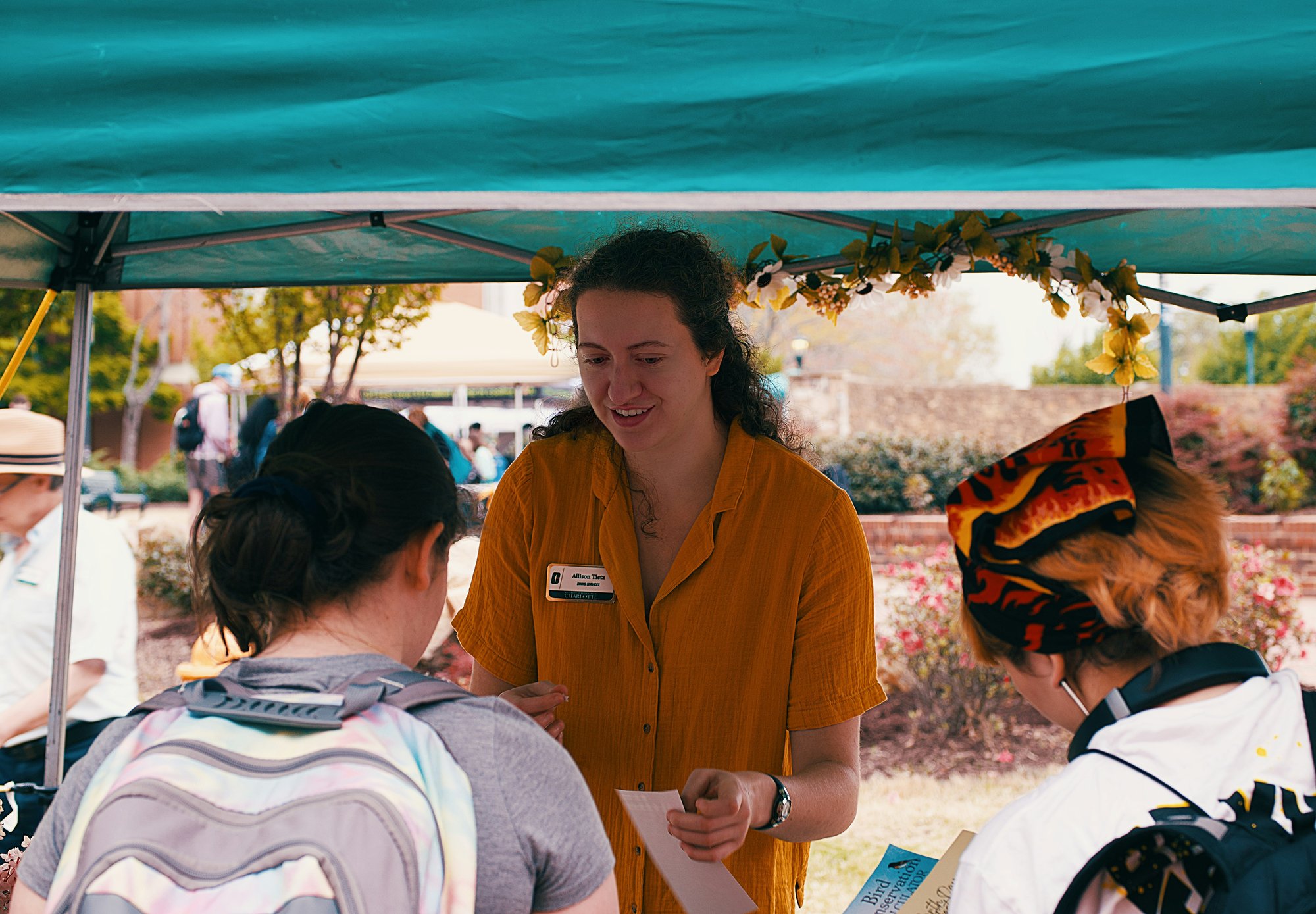 GivePulse campus administrator talking to students about volunteering