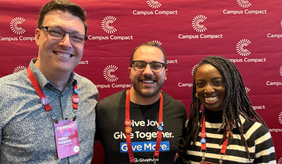 Background picture of GivePulse team members and colleagues from Kennesaw State University with text reading Kennesaw State Scales Student Volunteer Engagement with GivePulse.