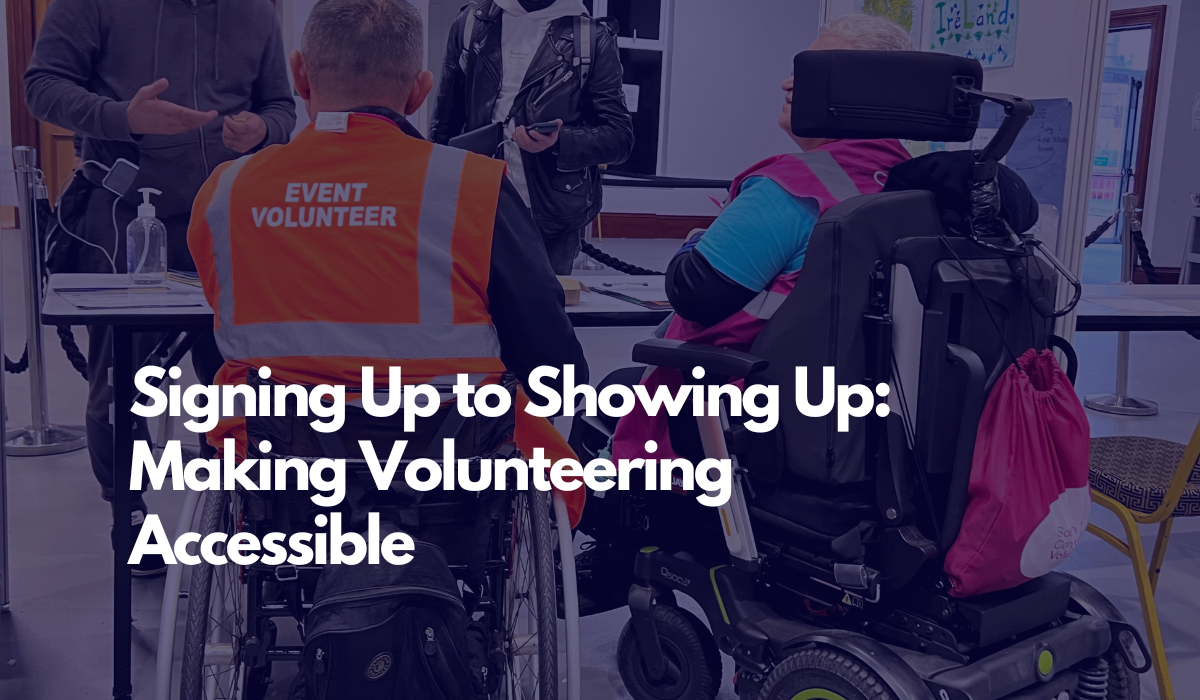 Background image of two volunteers in wheelchairs checking people in with text overlayed reading From Signing Up to Showing Up: Making Volunteering Accessible 