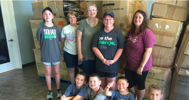 Connie Brown, top center, volunteers regularly with the Samaritan Center, a “grace-driven nonprofit organization with a mission to serve the hurting and hungry of Northwest Arkansas with dignity and compassion on a regular basis.