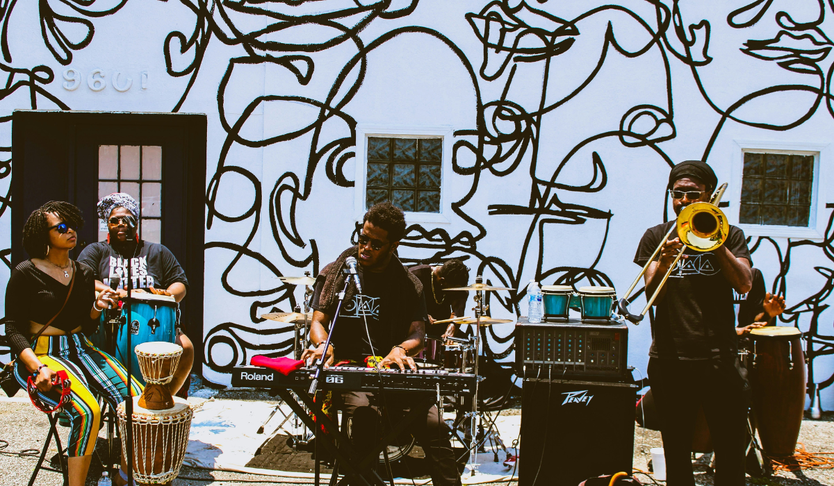 Background image of a band playing with text reading "Connect, Engage, and Empower Your Community" 